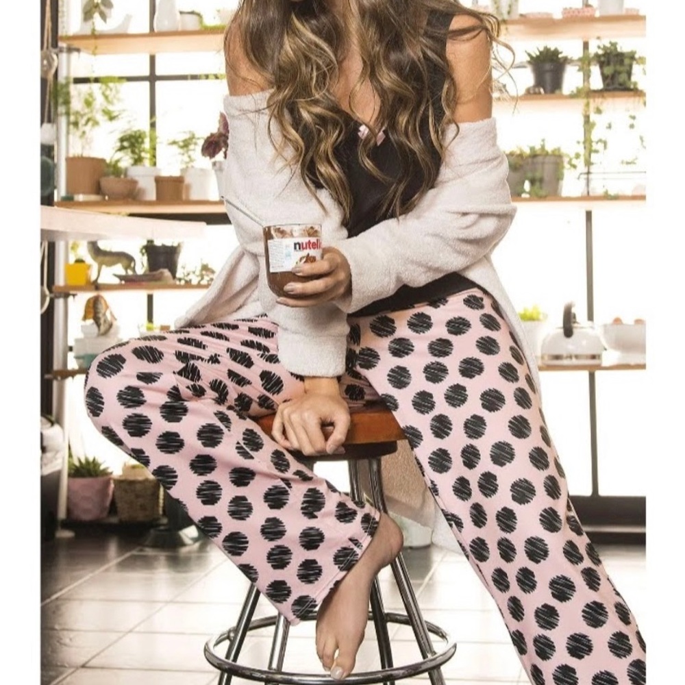 Women's pajamas with pants with black circles and a black sleeveless blouse